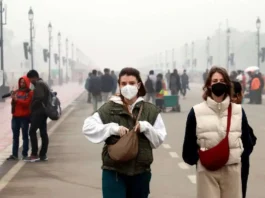 Women wear face masks amid a cold and foggy winter morning, at India Gate in New Delhi, Saturday, Dec. 30, 2023. PTI